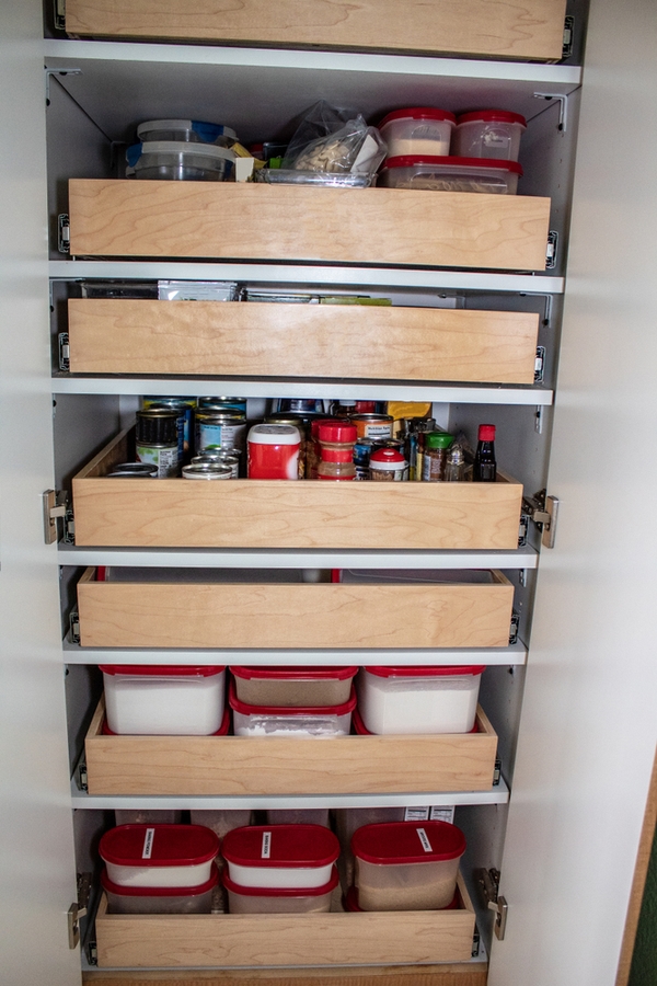 You may have a kitchen pantry design that is walk-in. Or your pantry space may be a wall of kitchen cabinets. If you're really lucky you may even have a butler's pantry. Whatever you've got, to get the most out of the space you need the best kitchen pantry design ideas out there. Pull out shelves will be the best feature of your pantry!